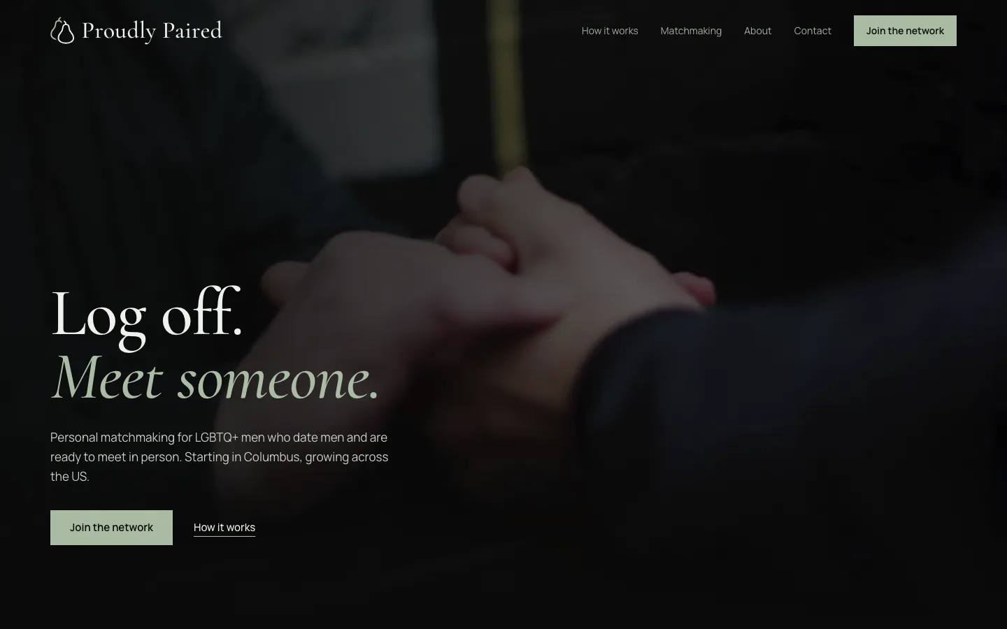 Proudly Paired homepage with the headline “Log off. Meet someone.” over a dark photo of clasped hands.
